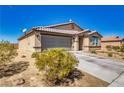 Charming single-story home with a well-maintained driveway and desert landscaping at 5360 S Chippewa St, Pahrump, NV 89061