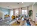 Inviting living room area with open layout, stylish decor, and comfortable seating at 7875 Pandora Sky St # 422, Las Vegas, NV 89084