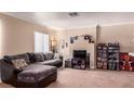 Inviting living room featuring a comfortable couch, neutral colors, and media storage at 8600 W Charleston Blvd # 2190, Las Vegas, NV 89117