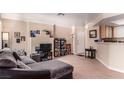 Open-concept living room with comfortable seating, natural light and a breakfast bar overlooking the kitchen at 8600 W Charleston Blvd # 2190, Las Vegas, NV 89117