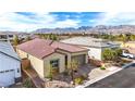 An aerial view of a neighborhood highlighting a single-story home with mountain views at 9993 Skye Gazer Ave, Las Vegas, NV 89166