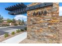 Stone wall at the entrance to the community, Aviano by Toll Brothers at 9993 Skye Gazer Ave, Las Vegas, NV 89166