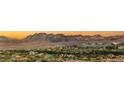 Panoramic view of a luxurious residential community nestled amidst scenic mountains, showcasing stunning architecture and landscaping at 10 Sand Star Ln, Henderson, NV 89011