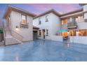 Spacious driveway with a courtyard featuring an outdoor seating area at 10412 Mansion Hills Ave, Las Vegas, NV 89144