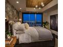 Comfortable bedroom with city views, stylish lighting, and a luxurious bed at 150 Las Vegas Blvd # 2015, Las Vegas, NV 89101
