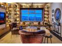 Inviting living room with custom bookshelves, exposed brick, and scenic city views at 150 Las Vegas Blvd # 2015, Las Vegas, NV 89101