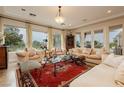 Bright living room showcasing large windows and stylish furnishings for a comfortable living space at 1704 Wincanton Dr, Las Vegas, NV 89134