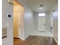 Welcoming entryway with tile and wood flooring, leading to a bright interior with neutral walls at 1809 Lazy Hill Ranch Way, North Las Vegas, NV 89081