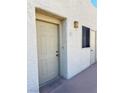 A close-up view of the unit's exterior front door and surrounding wall at 2064 Mesquite Ln # 303, Laughlin, NV 89029