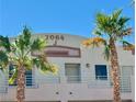 Close-up of the building's exterior featuring palm trees and a well-maintained facade at 2064 Mesquite Ln # 303, Laughlin, NV 89029