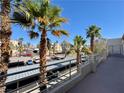 View from balcony overlooking parking area with palm trees at 2064 Mesquite Ln # 303, Laughlin, NV 89029