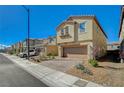 Two-story home with brick driveway, desert landscaping, and an attached two-car garage at 3164 Bormida Ave, Henderson, NV 89044