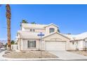 Charming two-story home featuring a two-car garage, a well-maintained and low maintenance front yard at 3425 Golden Sage Dr, North Las Vegas, NV 89032