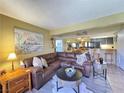 Relaxing living room featuring a large sectional sofa with seamless flow into the kitchen at 3740 Desert Marina Dr # 3, Laughlin, NV 89029