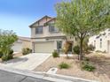 Charming two-story home with a well-manicured front yard and attached two-car garage at 4439 Yellow Harbor St, Las Vegas, NV 89129