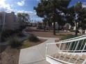 Well-manicured condo community with lush landscaping and inviting walkways between buildings at 6800 E Lake Mead Blvd # 1018, Las Vegas, NV 89156