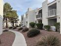 Well-maintained condo community featuring mature trees and desert landscaping at 6800 E Lake Mead Blvd # 1018, Las Vegas, NV 89156