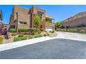 Lovely two-story home with a desert-landscaped yard, balcony, and three-car garage at 7222 Pulsar Mesa Ct, Las Vegas, NV 89148