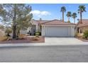 Charming single story home with mature landscaping, desert rock, and three-car garage at 8217 Ashkum Ave, Las Vegas, NV 89149