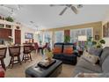 Open-concept living room with eat-in kitchen, dining area and comfortable seating at 8217 Ashkum Ave, Las Vegas, NV 89149
