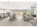 Bright, open floorplan features a spacious living area with views of the kitchen and backyard at 8575 Nicholas James Ave, Las Vegas, NV 89143
