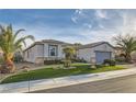 Charming single-story home features desert landscaping and an attached two car garage at 10235 Tresor Ct, Las Vegas, NV 89135