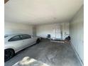 Spacious garage featuring a parked car, and multiple entry points at 1351 Dorothy Ave # 3, Las Vegas, NV 89119