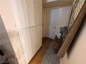 Narrow hallway with storage cabinets, neutral walls, and practical storage at 1351 Dorothy Ave # 3, Las Vegas, NV 89119