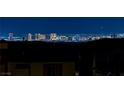 Stunning night view showcasing the illuminated Las Vegas skyline from a residential area at 180 Native Stone St, Las Vegas, NV 89138