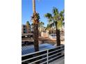 Scenic community view with palm trees, parking, and nearby buildings on a clear day at 2048 Mesquite Ln # 303, Laughlin, NV 89029