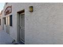 Exterior shot of the building's facade with a textured finish and a well-lit entrance at 2048 Mesquite Ln # 303, Laughlin, NV 89029