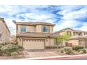 Attractive two-story home featuring a two-car garage and desert landscaping at 3725 Moonshine Falls Ave, North Las Vegas, NV 89085