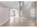 Bright, open living room with high ceilings and abundant natural light creates an inviting atmosphere at 3725 Moonshine Falls Ave, North Las Vegas, NV 89085