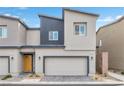 Modern two-story home with a two-car garage and a contemporary exterior design at 4125 Venus Falls Ave, North Las Vegas, NV 89084