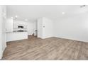 Bright, open living room featuring hardwood floors and neutral wall color at 4125 Venus Falls Ave, North Las Vegas, NV 89084