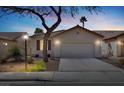 Charming single-story home with a well-manicured front yard, mature tree, and a two car garage at 4443 Verdiccio Ave, Las Vegas, NV 89141