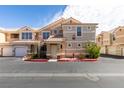 Charming two-story condo with tile roof and landscaped front entrance at 5855 Valley Dr # 2020, North Las Vegas, NV 89031