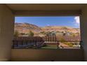 Breathtaking view of the desert and mountains from the balcony, showcasing the beauty of the surrounding landscape at 6197 Jewel Vista St, Las Vegas, NV 89135