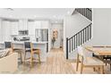 Open-concept living room with hardwood floors and access to the kitchen and dining areas at 7350 N Decatur Blvd # 5, Las Vegas, NV 89131