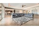 Spacious living room with plush seating, modern decor, and seamless access to the kitchen at 8514 Garnet Lake Ave, Las Vegas, NV 89113