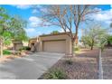 Attractive one-story home with a neutral color scheme, spacious driveway, and low-maintenance landscaping at 9013 Litchfield Ave, Las Vegas, NV 89134