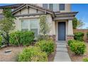 Charming two-story home with a landscaped front yard and inviting entrance at 10247 Gladstone Peak St, Las Vegas, NV 89166