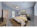 Serene bedroom featuring a ceiling fan, and ample natural light from the window at 10924 Bandol Pl, Las Vegas, NV 89141