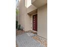 Stylish front door and walkway enhance curb appeal in this modern home, beautifully landscaped at 11357 Gravitation Dr, Las Vegas, NV 89135