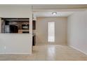 Bright open room with tile flooring, dark cabinets, granite counters, and a large window at 1405 Vegas Valley Dr # 170, Las Vegas, NV 89169