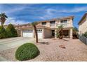 Attractive two-story home features a terracotta roof, complemented by desert landscaping at 1730 Juniper Twig Ave, Las Vegas, NV 89183