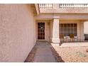 Charming covered front porch with seating area, perfect for enjoying the outdoors at 1730 Juniper Twig Ave, Las Vegas, NV 89183