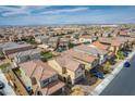 Expansive aerial view of a well-maintained neighborhood with a mix of home styles and landscaped yards at 1819 Wild Grain Ave, North Las Vegas, NV 89086