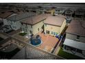 Aerial view of a backyard with a trampoline, patio and fenced yard at 1819 Wild Grain Ave, North Las Vegas, NV 89086