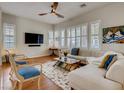 Bright living room featuring large windows, comfortable seating, and a modern entertainment setup for relaxation at 1973 Ardilea St, Las Vegas, NV 89135
